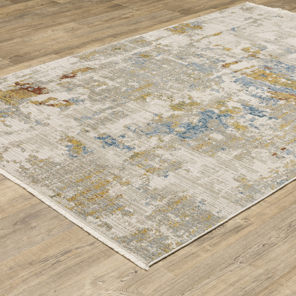 10' X 13' Beige Grey Gold Blue Rust And Teal Abstract Power Loom Stain Resistant Area Rug With Fringe