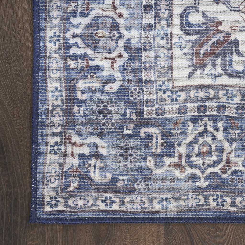 10' Blue and Ivory Floral Power Loom Distressed Washable Runner Rug